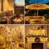 Collage of four scenes showing warm white string lights used for decoration in various settings, including a balcony, patio, wall display, and fireplace. Produktbild-Vorschau