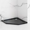 A black corner shower tray is shown in a bathroom setting with marble-effect tiles on the wall and floor. Produktbild-Vorschau