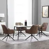 A dining table set with four chairs in a well-lit room. Produktbild-Vorschau