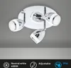 A modern chrome ceiling light with three adjustable spotlights against a plain gray background. Produktbild-Vorschau