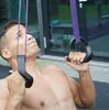 A man is performing an exercise with resistance bands. Náhľad obrázku produktu