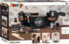 The image shows the retail packaging of a Smoby Barber Belt toy set, displayed on a wooden surface with a light gray background featuring barber-themed graphics. Produktbild-Vorschau