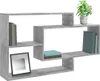 A modern, grey, geometric wall shelf unit with books, a framed picture, and a potted plant. Produktbild-Vorschau