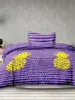 A bed with purple and white striped bedding featuring yellow pineapple prints. Produktbild-Vorschau