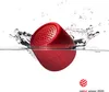 A red Bluetooth speaker is partially submerged in water, creating a splash. Náhľad obrázku produktu