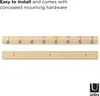 A product image showing a wooden coat rack with flip-down hooks and its mounting hardware. Produktbild-Vorschau