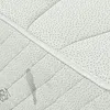 A close-up view of a quilted mattress surface with a decorative corded edge. Produktbild-Vorschau