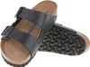 A pair of black Birkenstock Arizona sandals shown from a slightly elevated angle against a white background. Anteprima dell’immagine prodotto