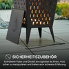 A black metal fire pit with a lid and a poker on a tiled patio. Náhled obrázku produktu