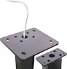 A close-up shot of two black metal bases for a stand, with a white cable emerging from the top of one. Voir les images du produit