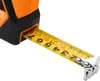 A close-up shot of a tape measure extending from its orange and black housing. Produktbild-Vorschau