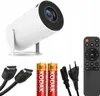 A white LED projector with accessories, including a remote control, HDMI cables, batteries, and a power cord, arranged on a white background. Náhled obrázku produktu