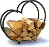 A heart-shaped metal log holder filled with firewood, presented on a white background. Produktbild-Vorschau