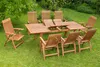 A wooden garden furniture set including a table and chairs placed on a lawn. Produktbild-Vorschau