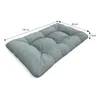A light blue tufted cushion with dimensions indicated by lines and text. Voir les images du produit
