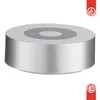 A silver cylindrical speaker with a gray top surface showing control buttons. Náhľad obrázku produktu