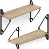 Two wooden shelves with black metal brackets are mounted on a white wall. Náhled obrázku produktu