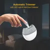 A hand is shown using an automatic nail trimmer with an LED light and nail dust collector, placed on a bed in a dimly lit room. Voir les images du produit