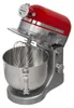 A red and silver stand mixer with a whisk attachment inside the bowl. Podgląd zdjęcia produktu