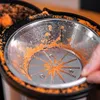Close-up of a juicer after use, with orange pulp visible. Produktbild-Vorschau