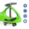 A green ride-on toy car with a black steering wheel and black wheels, shown from a side angle against a white background. Several circular icons with text and symbols are visible on the right side of the image. Náhled obrázku produktu
