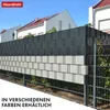 A fence made of dark gray and light gray PVC privacy strips installed on a metal fence, with houses in the background. Produktbild-Vorschau