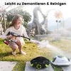 A woman is demonstrating a cleaning device in an outdoor garden setting. Anteprima dell’immagine prodotto