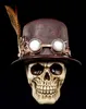 A steampunk-themed skull wearing a hat and goggles, set against a black background. Produktbild-Vorschau