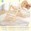 A wooden climbing triangle toy is shown indoors on a rug, with a hand demonstrating a locking mechanism. Produktbild-Vorschau
