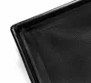 Close-up view of the corner of a black storage pouf. Podgląd zdjęcia produktu