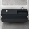 A modern bathroom vanity with a sink and faucet, set against a concrete wall. Anteprima dell’immagine prodotto