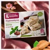 Kandylas Halva mit Mandeln & Stevia 400 g Verpackung auf rosa Stoff mit Blüten Produktbild-Vorschau