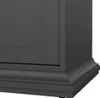 A close-up view of the bottom corner of a dark gray sideboard, showing its base and a section of the cabinet. Produktbild-Vorschau