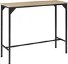 A high-top table with a tan wood-grain surface and black metal legs. Náhled obrázku produktu