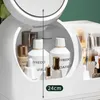 A close-up view of a white cosmetic organizer filled with various makeup and skincare products. Anteprima dell’immagine prodotto