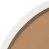 A close-up view of the edge of a round mirror frame and its backing. Produktbild-Vorschau