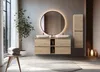 A modern bathroom with a double vanity, a large round mirror with backlighting, and a tall cabinet. A plant and towels are also visible. Podgląd zdjęcia produktu