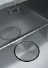 A close-up view of a stainless steel sink with a drain cover and a brand logo. Náhled obrázku produktu