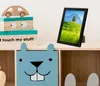 A framed picture on a shelf with decorative boxes and a cubby organizer. Náhled obrázku produktu