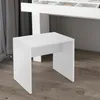 A white stool is placed in front of a white desk with drawers. Produktbild-Vorschau