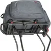 A close-up view of a bicycle rear rack with a gray bag attached. Podgląd zdjęcia produktu