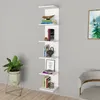 A white wall-mounted shelf unit with books and decorative items. Náhľad obrázku produktu