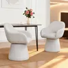 Two light gray swivel chairs are placed around a dining table in a well-lit room. Podgląd zdjęcia produktu