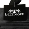 A close-up of a black handbag with a branded tag attached. Produktbild-Vorschau