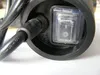 Close-up of a black electrical cord entering a black housing with a clear toggle switch. Náhled obrázku produktu