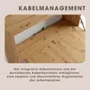 Close-up view of a wooden desk with cable management features, with text overlay describing the functionality. Produktbild-Vorschau