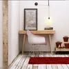 A cozy corner with a desk, chair, and plants. Anteprima dell’immagine prodotto