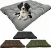 A dog lying on a large gray dog bed, with three other dog beds in different colors shown below. Anteprima dell’immagine prodotto