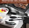 A close-up shot of grilling accessories and food on a grill. Produktbild-Vorschau