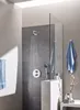A modern bathroom with a shower, towels, and decorative items. Produktbild-Vorschau